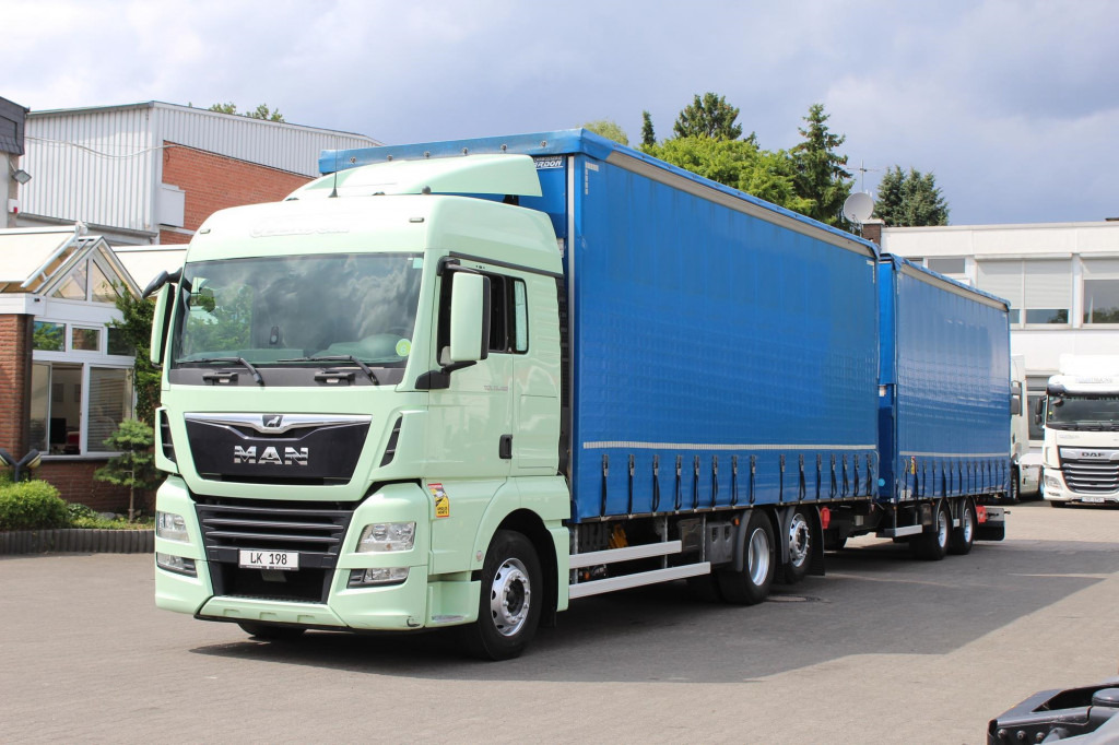 MAN TGX 26.460 Retarder Jumbo-Zug 120M3 Durchlade - Curtain side truck: picture 1 MAN TGX 26.460 Retarder Jumbo-Zug 120M3 Durchlade - Curtain side truck: picture 1