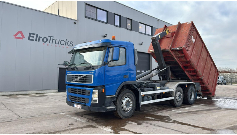 Volvo FM 9 - 300 (BELGIAN TRUCK / CAMION BELGE / INCL CONTAINER / 6X2 / GOOD TYRES) - Hook lift truck: picture 1 Volvo FM 9 - 300 (BELGIAN TRUCK / CAMION BELGE / INCL CONTAINER / 6X2 / GOOD TYRES) - Hook lift truck: picture 1
