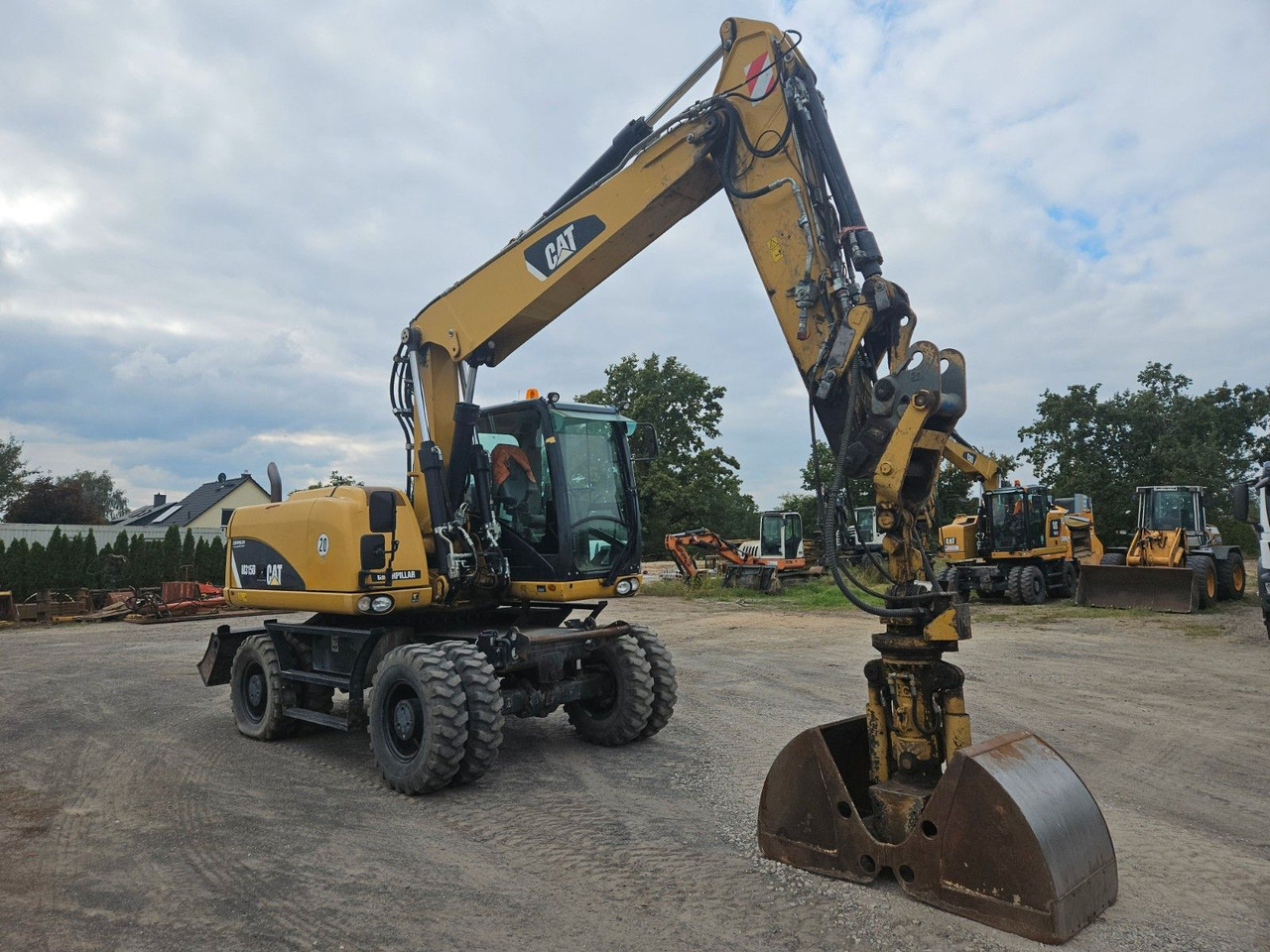 CAT M315D Mobilbagger orig. 4.080h ! 3 Anbauteile - Wheel excavator: picture 3 CAT M315D Mobilbagger orig. 4.080h ! 3 Anbauteile - Wheel excavator: picture 3