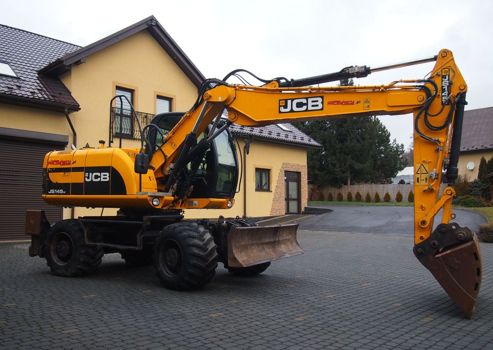 Koparka kołowa JCB JS145W 2011 Koparka JCB - Wheel excavator: picture 1 Koparka kołowa JCB JS145W 2011 Koparka JCB - Wheel excavator: picture 1