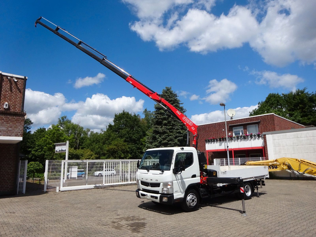 FUSO Canter 7C15 mit FASSI F65A Kran - Open body delivery van: picture 1 FUSO Canter 7C15 mit FASSI F65A Kran - Open body delivery van: picture 1