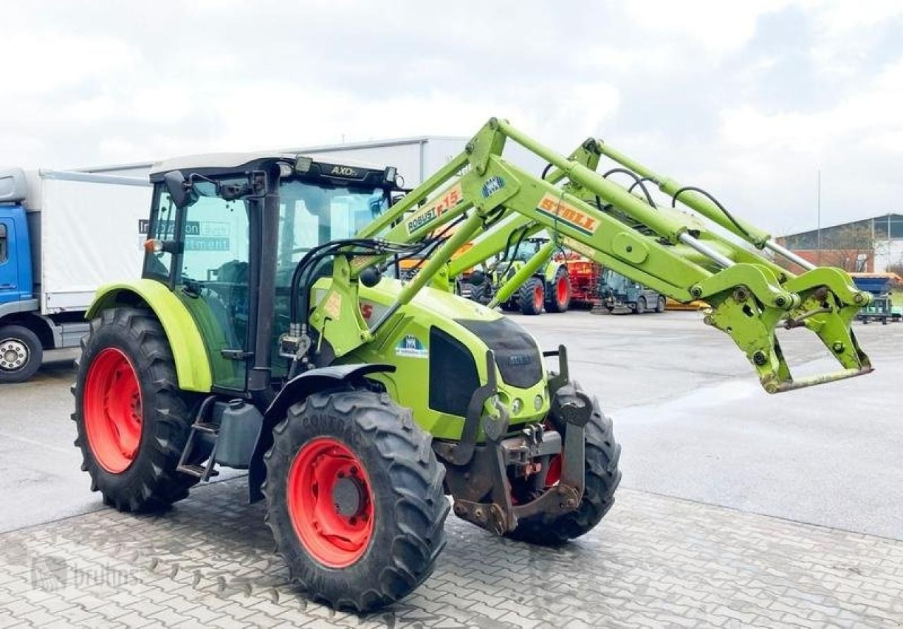 CLAAS axos 320 mit stoll frontlader - Farm tractor: picture 1 CLAAS axos 320 mit stoll frontlader - Farm tractor: picture 1