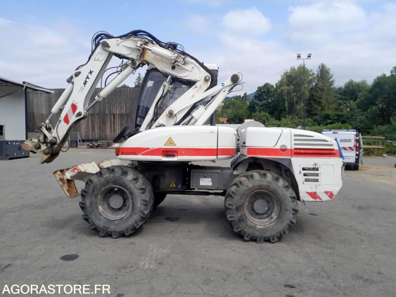 PELLE SUR PNEUS - MECALAC - 12 MTX - 2012 / 11451 HEURES (M4476) - Excavator: picture 1 PELLE SUR PNEUS - MECALAC - 12 MTX - 2012 / 11451 HEURES (M4476) - Excavator: picture 1